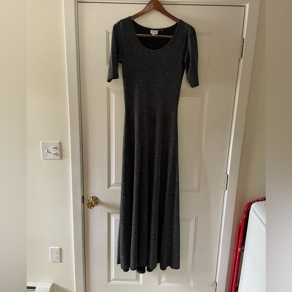 Long glittering silver evening dress.